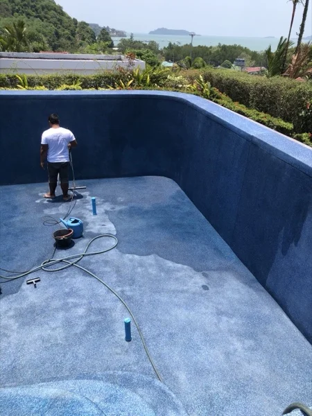 Washing the newly laid finish back with a pressure lance to expose the glass