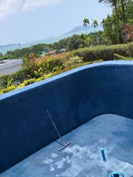 The new finish laid across the floor and walls of the pool, with the sea beyond