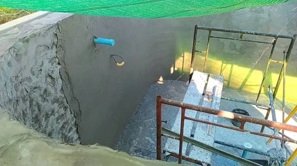 New render going on over the stripped wall of the pool