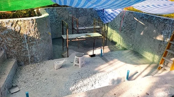 The pool shell after the old finish was stripped back to the concrete