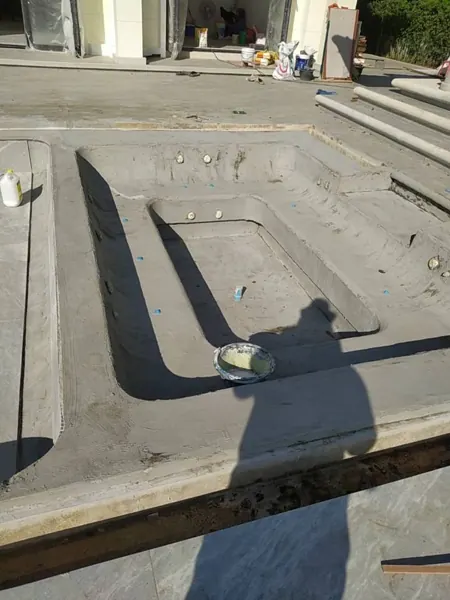 Private Villa, Laguna — Raindrop: the seat ledge around the jacuzzi, ready for the finish