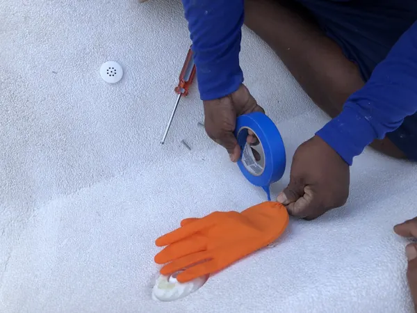 Private Villa, Laguna — Raindrop: protecting a light fitting before the finish goes on