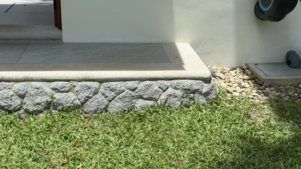 Private Villa, Laguna — Raindrop: the coping beside the lawn