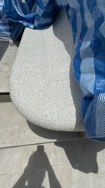 Private Villa, Layan Beachfront — the rounded end of a bench