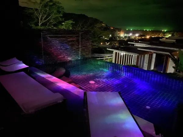 Private Villa, Naithon Beach — the tiled pool lit at night, before the new finish