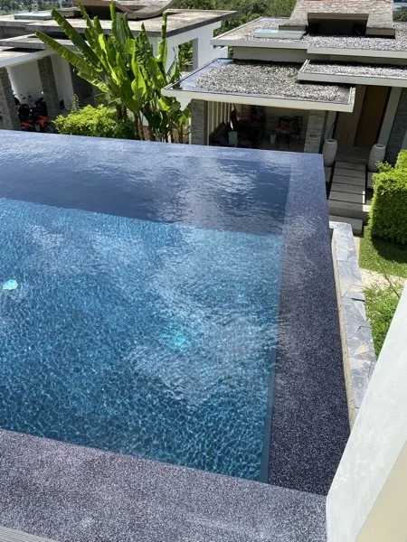 The Nightfall Pearl surround where it meets the planting at the corner of the pool