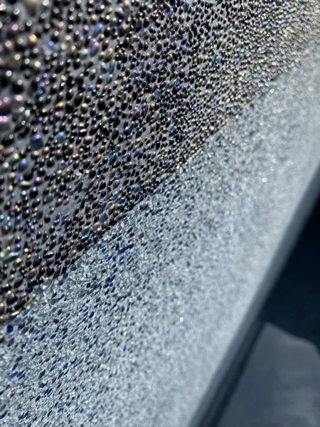 Close view of Nightfall Pearl meeting Royal Blue at the coping of the pool