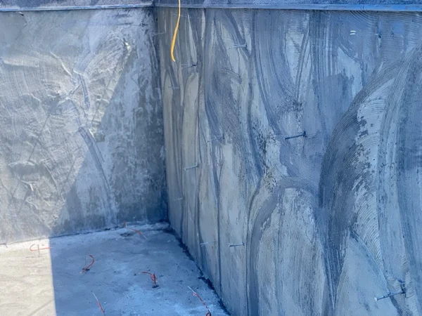 Bond coat worked into the corner of the pool shell ahead of the finish