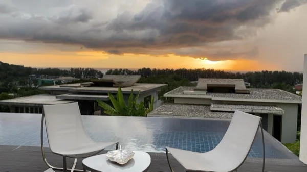 The terrace and the tiled pool before the renovation, looking out over the estate