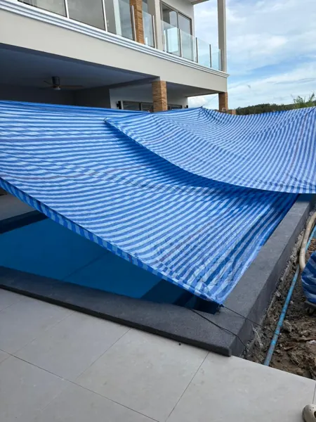 Private Villa, Pasak — the pool kept under shade while the finish cured