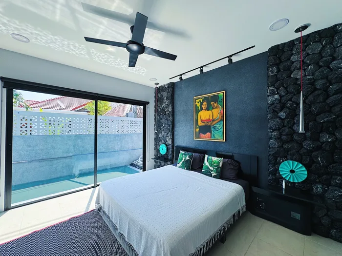 Private Villa, Nai Yang — the custom PebbleCrete Glass wall in master bedroom
