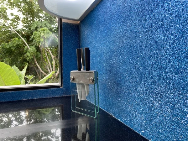 Private Villa, Nai Yang — the kitchen wall in turquoise PebbleCrete Glass