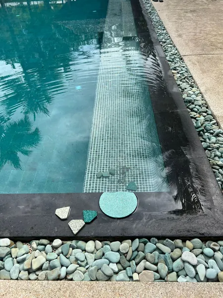 Private Villa, Red Palm — Irish Green — samples laid out at the pool edge