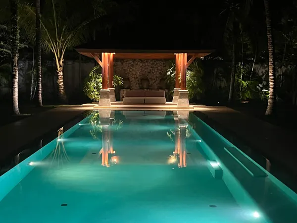 Private Villa, Red Palm — Irish Green — the pool lit at night