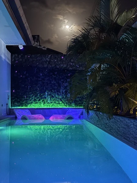 Private Villa, Phuket — coloured galaxy projection and fibre-optic lighting on the black marble wall