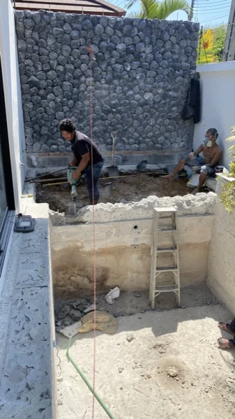 Private Villa, Phuket — the rough black marble wall, seen from the empty pool