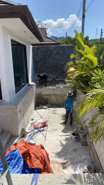 Private Villa, Phuket — the finished black marble wall from the deck