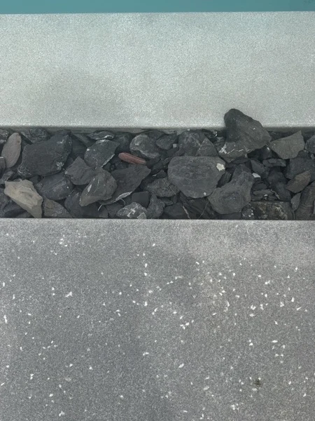 Private Villa, Phuket — PebbleCrete Glass overflow and overflow channel filled with rough black marble