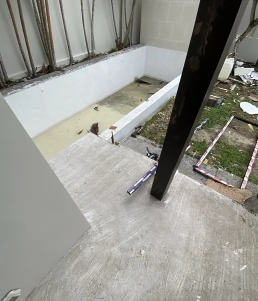 Private Villa, Rawai — Pearl White — the unfinished pool, with rainwater and leaves on the floor
