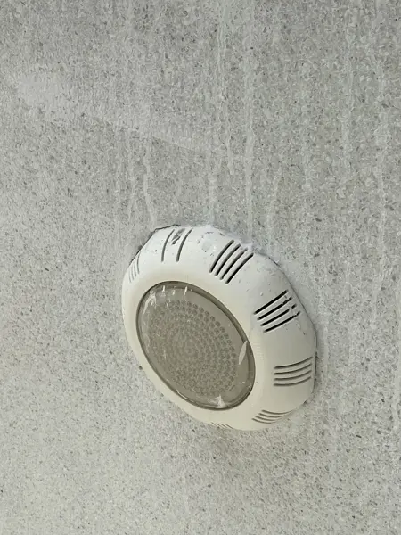 Private Villa, Rawai — Pearl White — one of the old pool lights in the sandwash wall