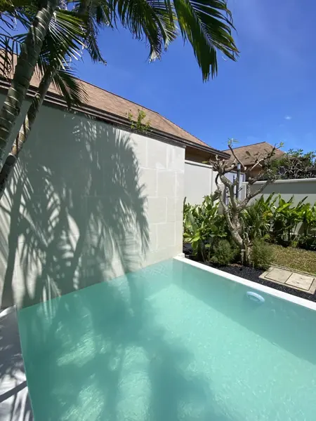 Private Villa, Rawai — Pearl White — the end wall in the shade of the palms