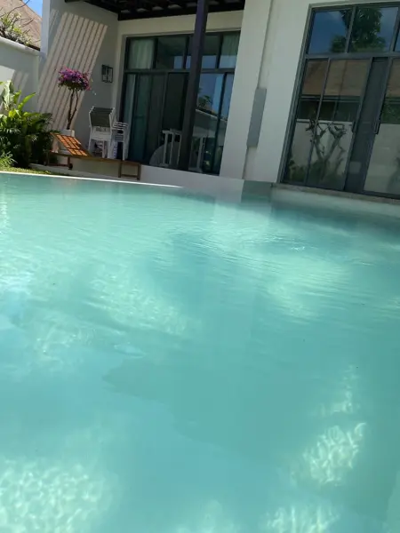 Private Villa, Rawai — Pearl White — the pool in front of the villa's glass doors