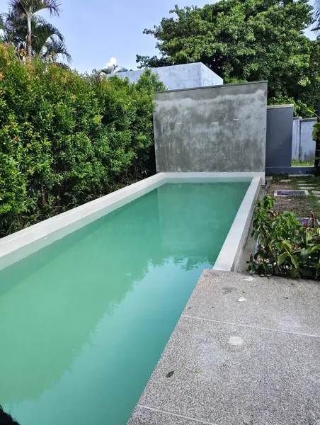 Onyx Villas, Rawai — the pool towards the feature wall