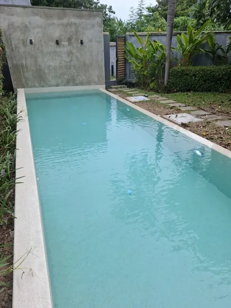 Onyx Villas, Rawai — the full length of the pool in Polar White