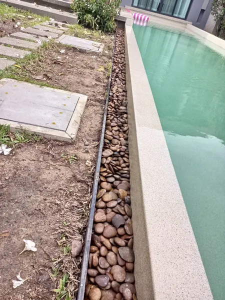 Onyx Villas, Rawai — river pebbles along the pool edge