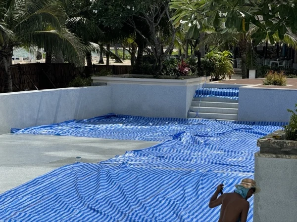 SAii Phi Phi — sheets spread across the pool over the new finish