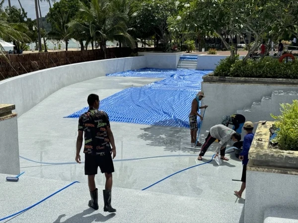 SAii Phi Phi — pulling the shade sheets across the pool