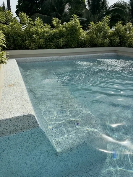 SAii Phi Phi — the pool edge against the planting