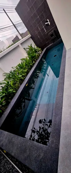 Sea Stone Private Pool Villas — the renovated pool and its coping
