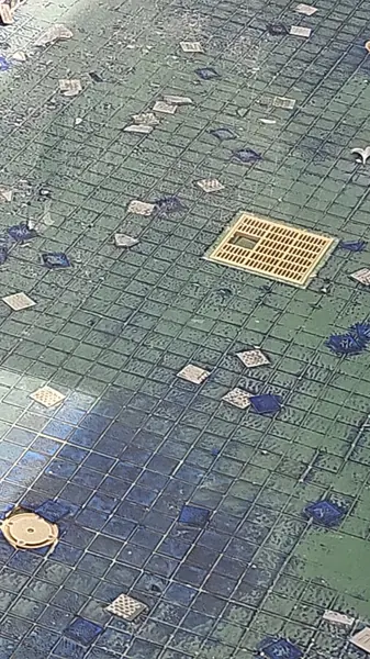 Sea Stone Private Pool Villas — the mosaic coming away around the drain