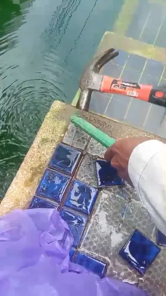 Sea Stone Private Pool Villas — taking the mosaic off with a hammer and a spike