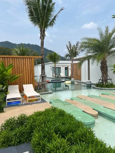 Sugar Marina Lagoon — sun beds beside the shallow pads