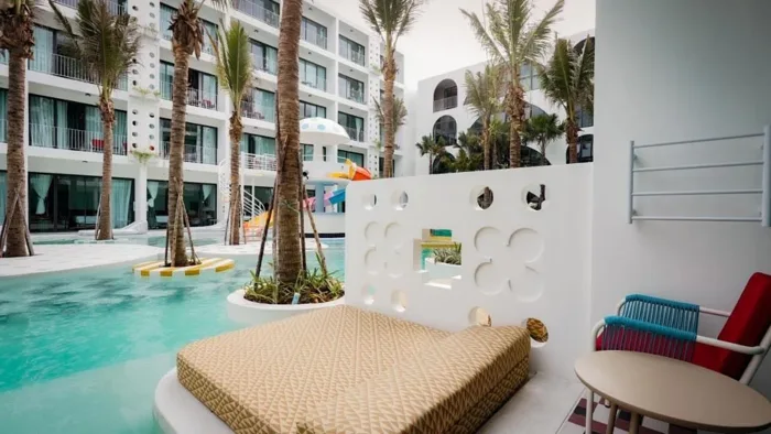 Sugar Marina POP – Kata Beach — poolside seating along the building