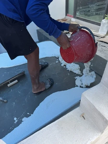 Sugar Marina POP, Kata Beach — placing the mixed finish on the prepared surface