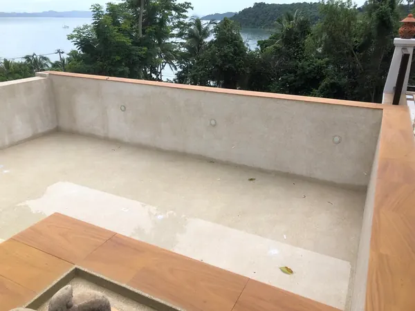 The Estate, Ao Po — the finished shell and the sea view