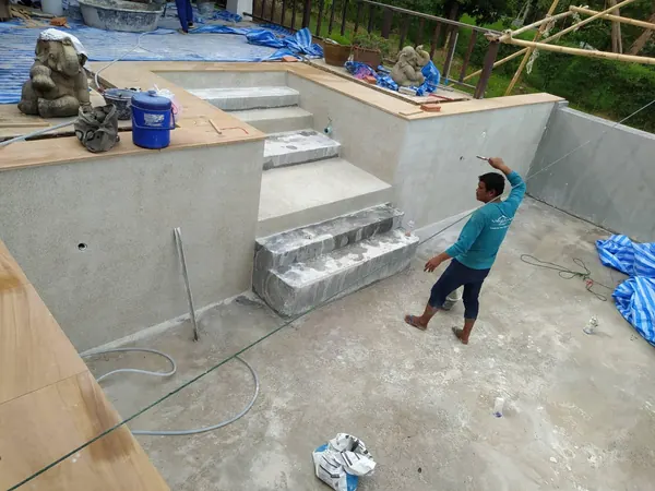 The Estate, Ao Po — washing the new finish on the steps