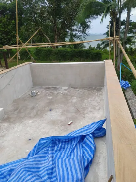 The Estate, Ao Po — the rendered shell with the new coping