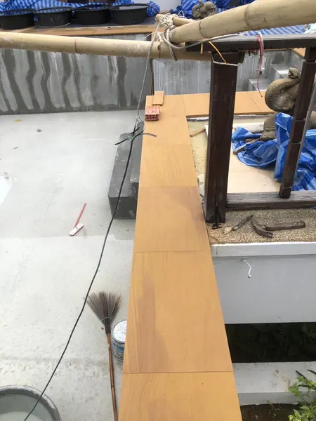 The Estate, Ao Po — setting the sandstone coping