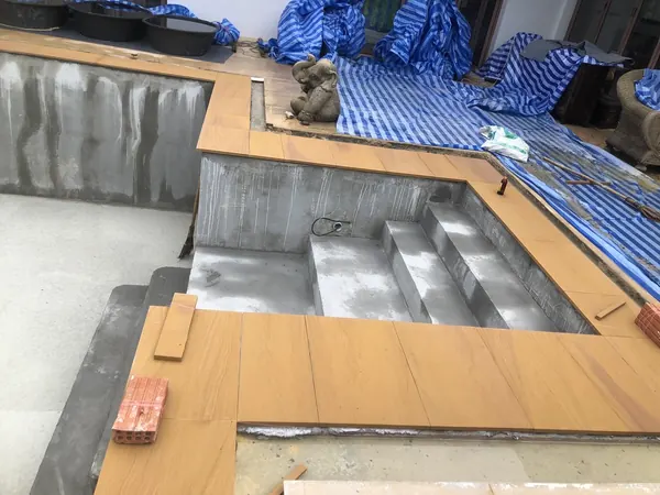 The Estate, Ao Po — sandstone coping around the new steps