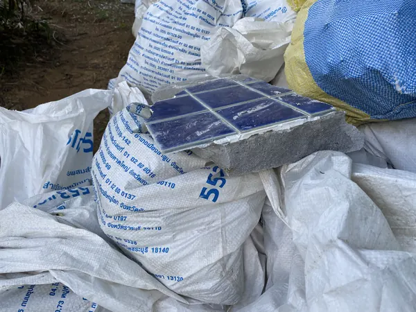 The Estate, Ao Po — the old tiling bagged for removal