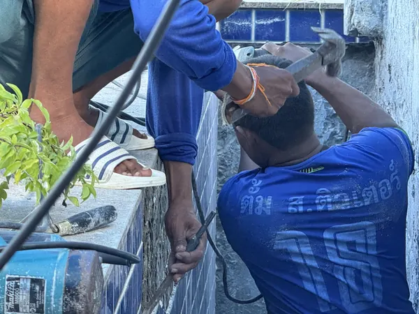 The Estate, Ao Po — taking the old tiling off the wall