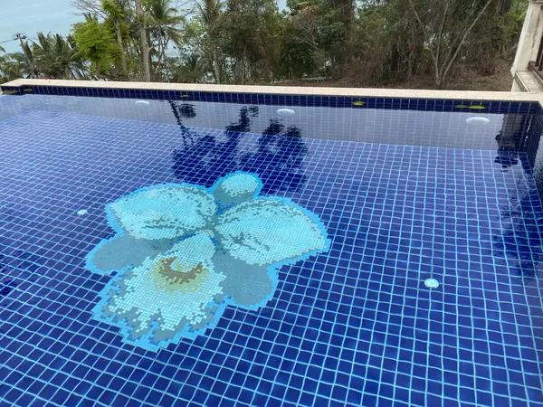 The Estate, Ao Po — the tiled flower on the old pool floor