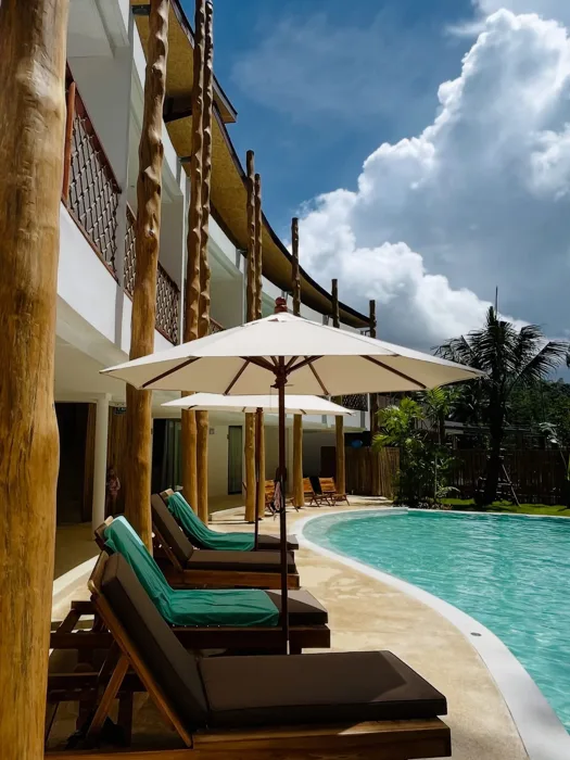 The Talay — the pool edge beside the loungers