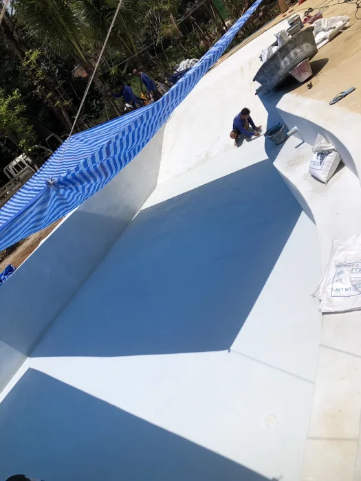 The Talay — finish application along the pool walls and steps