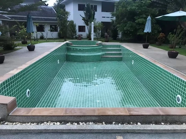 Private Villa, Khao Lak — the old pool drained, its green tiling still in place