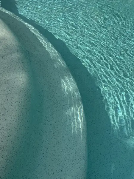 Villa Colina, Khao Lak — the curved edge of the shallow ledge under clear water